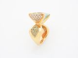 a close up of a gold ring with a green and white diamond