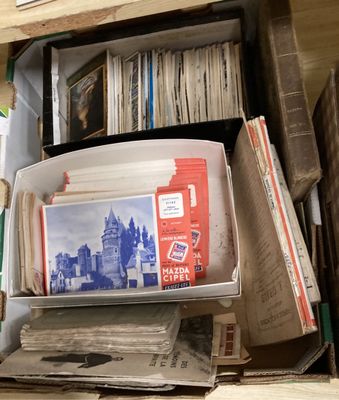 a stack of books and magazines on a shelf