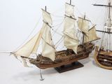 a model of a sailing ship and a model of a sailing ship