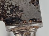 a large knife that is on top of a table