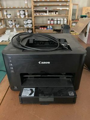 a printer that is sitting on a table in a room