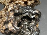 a close up of a piece of rock with some sort of substance on it