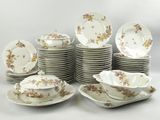 a lot of plates and bowls that are stacked together