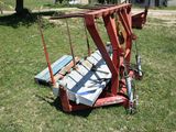 a red crane that is sitting in the grass