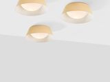 three light fixtures on a ceiling with a white background