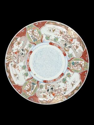 a plate with a design on it on a black background
