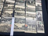 a lot of old postcards sitting on a table