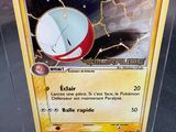 a close up of a pokemon card with a clock on it