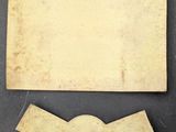 two pieces of paper and a piece of paper on a table