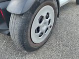 a car that has a flat tire on the street