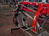 a gym with a row of machines in the background