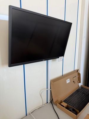 a laptop and a keyboard in a box on a table