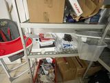 a shelf that has many items on it in the room