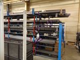a large rack of metal items in a warehouse