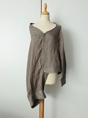 an image of a dress on a mannequin stand with a white wall in the background