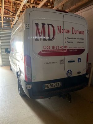 a van that is parked in a garage with the door open