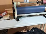 a roll of paper sitting on a table next to a bag