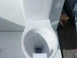 a white toilet with a sign on it that says it is not a toilet