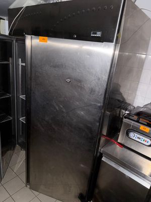 an image of a kitchen with a stainless steel refrigerator