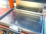 an image of a grill with a grill top on it