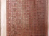 a red screen that is on the side of a building
