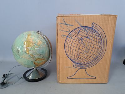 a cardboard box with a drawing of a globe on it