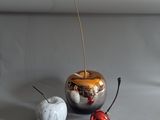 two apples and an apple sitting on a table