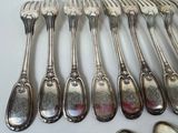 a lot of spoons that are sitting on a table