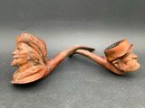 a close up of a pipe with a man ' s face on it