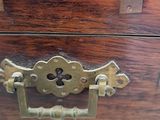a small wooden box with a lock on it