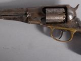 a close up of a revolver on a table with a white background