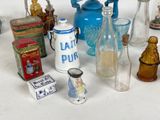 many different types of glass bottles on the table