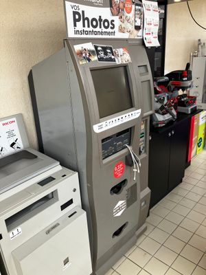 two machines that are sitting next to each other on the floor