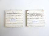 two pieces of paper that are on the wall