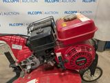 an image of a small engine that is on the ground