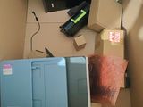 a tv and a printer in a box on the floor