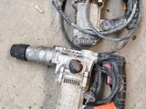 two power tools that are laying on the ground