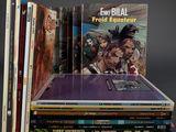 several books are stacked on top of each other on a table