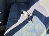 a seat in the back of a car with a seat belt