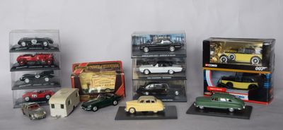 a lot of different model cars in a display case
