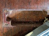 a knife that is laying on a wooden table