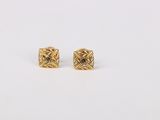 a pair of gold earrings with black diamonds