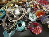 a pile of assorted jewelry on a table