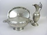 a silver bowl and a silver vase on a white background