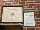 a picture of a sign on a brick wall