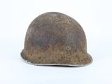 an old helmet on a white surface with a white background