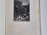 an old book with a picture of a man laying on the ground