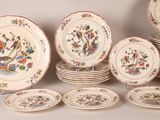 many plates and cups that are sitting on a table