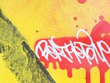 a picture of graffiti on the wall of a skateboarder