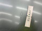 a measuring tape on the side of a metal container